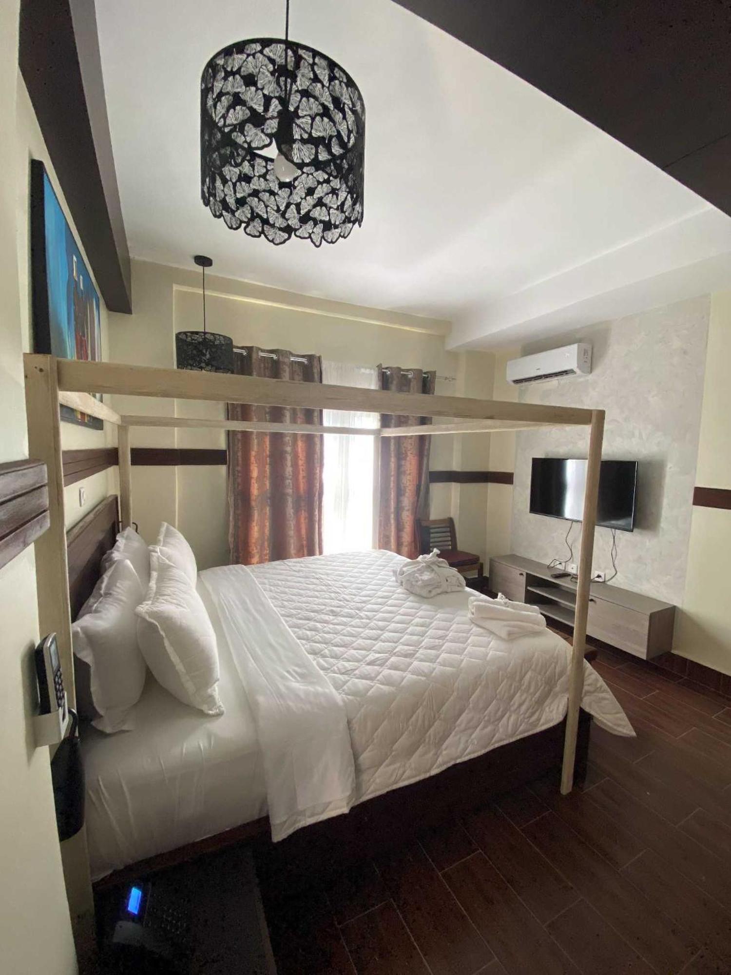 Boutique Hotel Pavillon Abidjan Bilik gambar